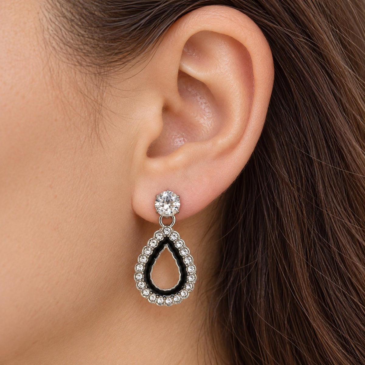 Model wearing Noir Teardrop Halo Drop Earrings in silver tone
