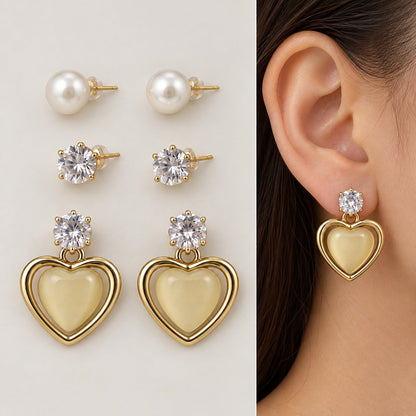 Model wearing Opaline Heart Earring Trio stacked on one ear