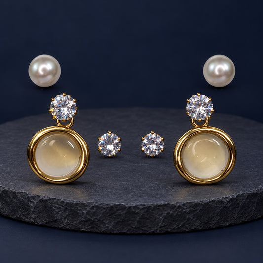 Opaline Orbit Earring Trio Set with pearl studs, zirconia studs and round gold drops on marble
