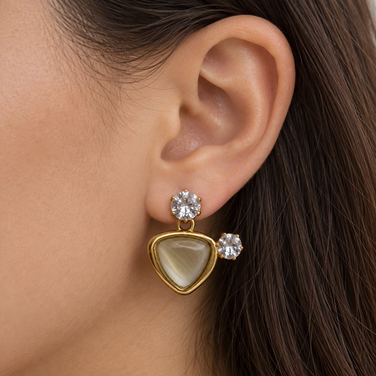 Model wearing Opaline Trillion Earring Trio stacked on one ear