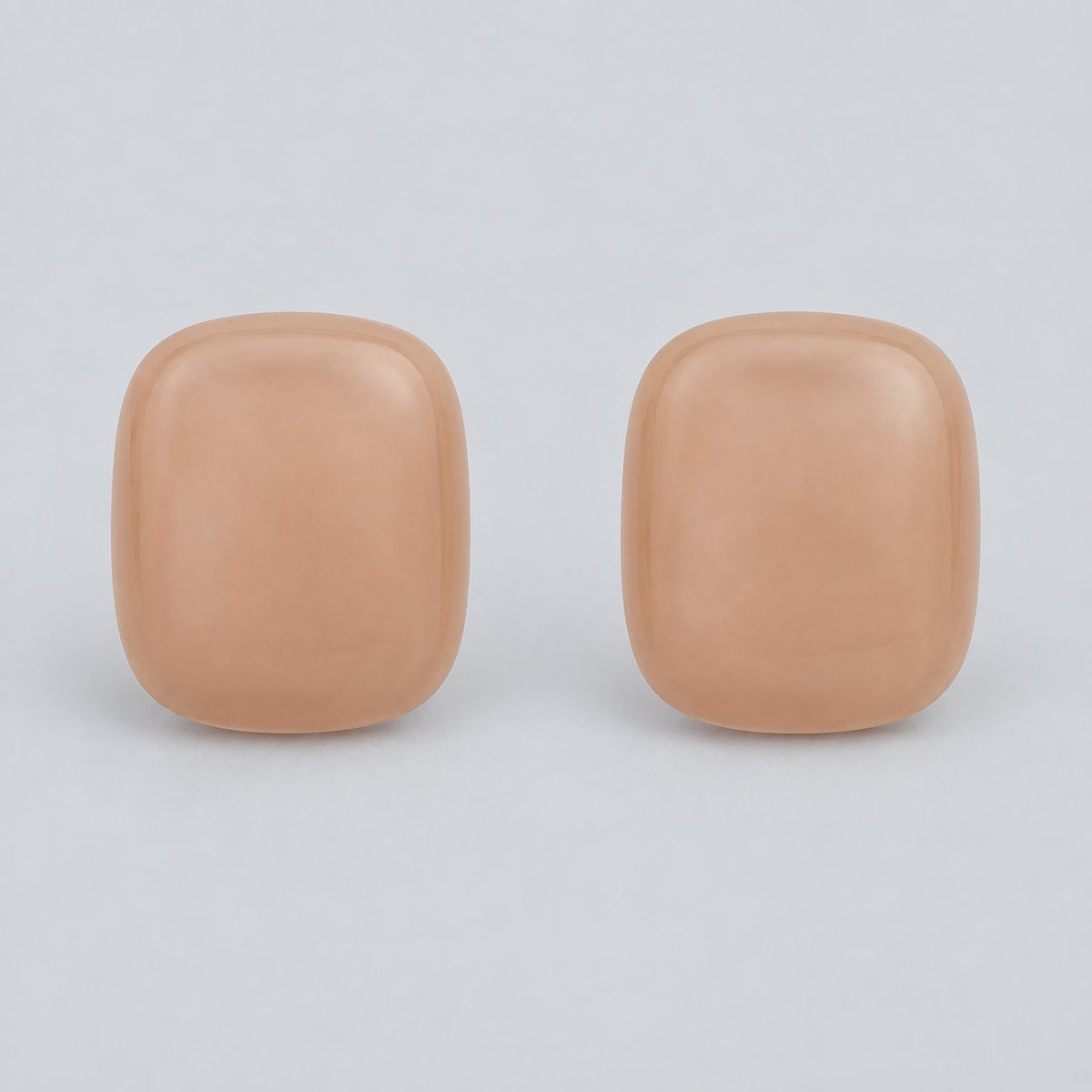 Front view of peach blush cushion cabochon stud earrings