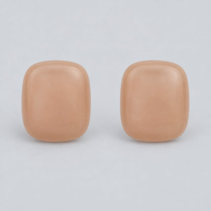 Front view of peach blush cushion cabochon stud earrings