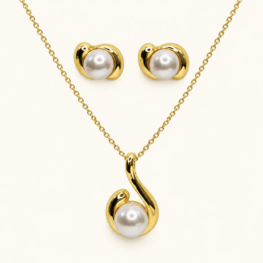 Front view of gold-tone swirl pearl pendant necklace with matching stud earrings