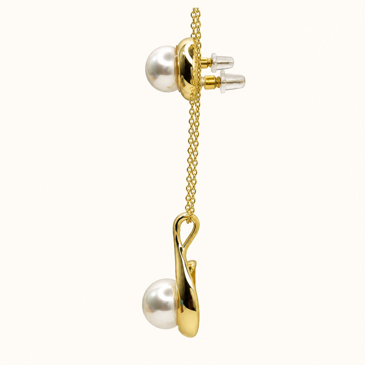 Side view of Pearl Swirl Necklace Set showing the pendant profile and push-back earring posts