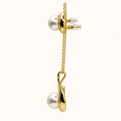 Side view of Pearl Swirl Necklace Set showing the pendant profile and push-back earring posts