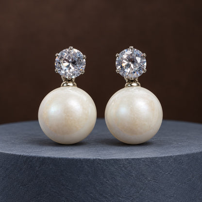 Pearl White Lustre Orb Drop Earrings in silver tone with zirconia studs on marble