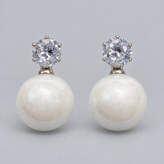 Front view of pearl white lustre orb drop earrings with cubic zirconia tops