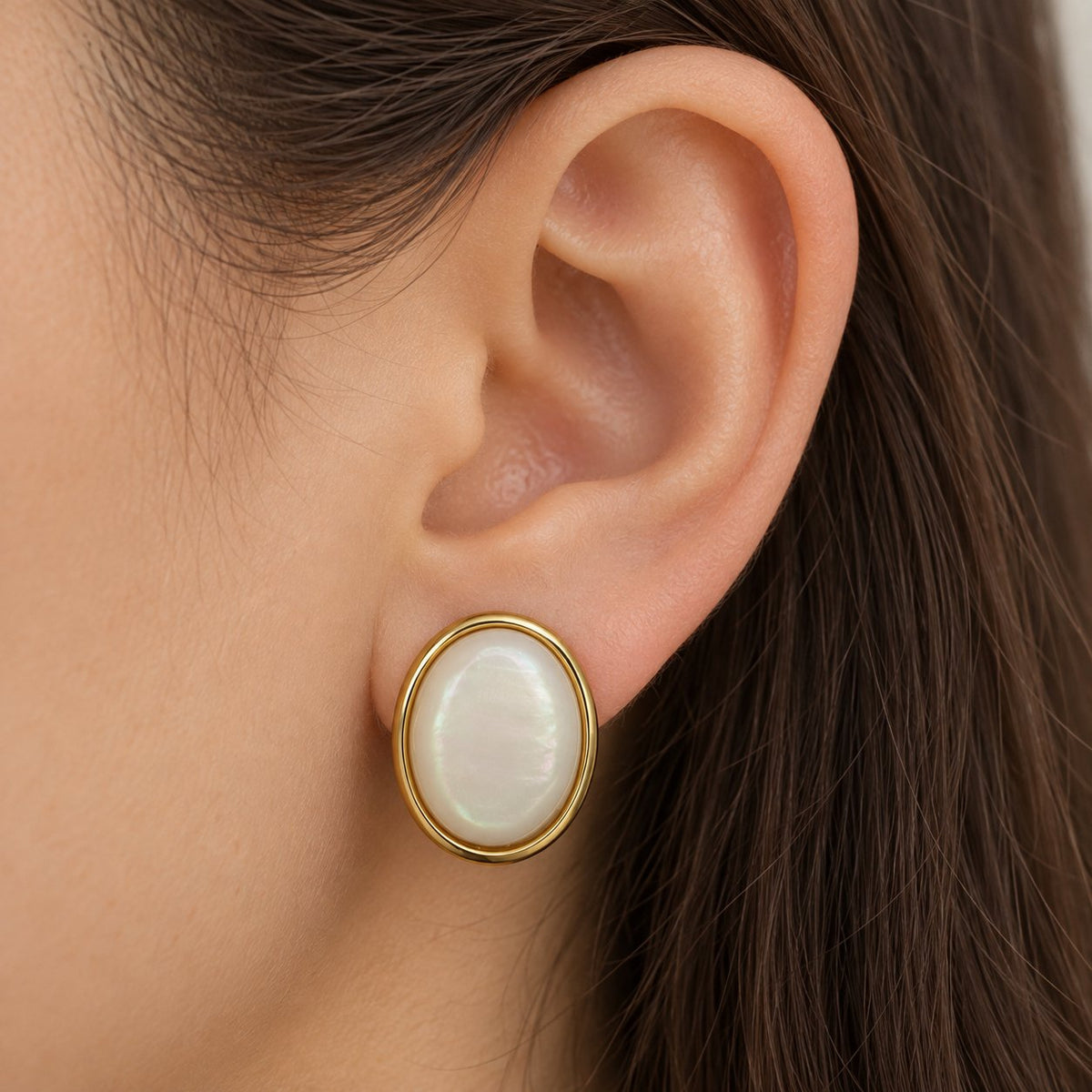 Model wearing Pearlescent Oval Dome Stud Earrings