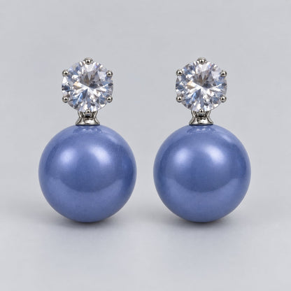 Front view of periwinkle blue lustre orb drop earrings with cubic zirconia tops
