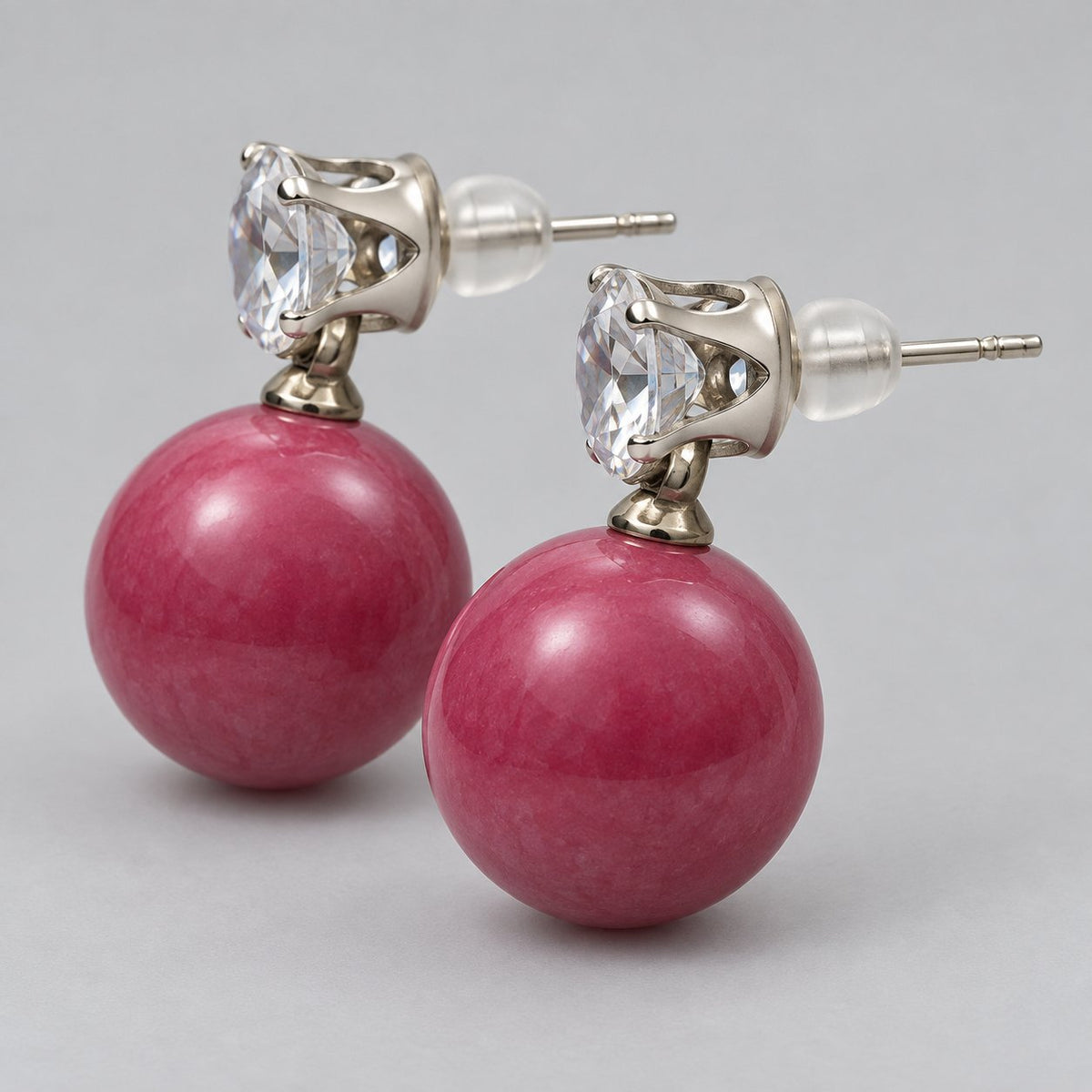 Side view of Raspberry Pink Lustre Orb Drops showing the prong-set top and push-back post