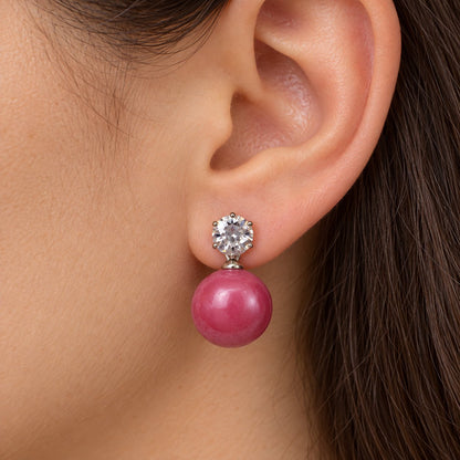 Model wearing Raspberry Pink Lustre Orb Drops silver-tone orb drop earrings