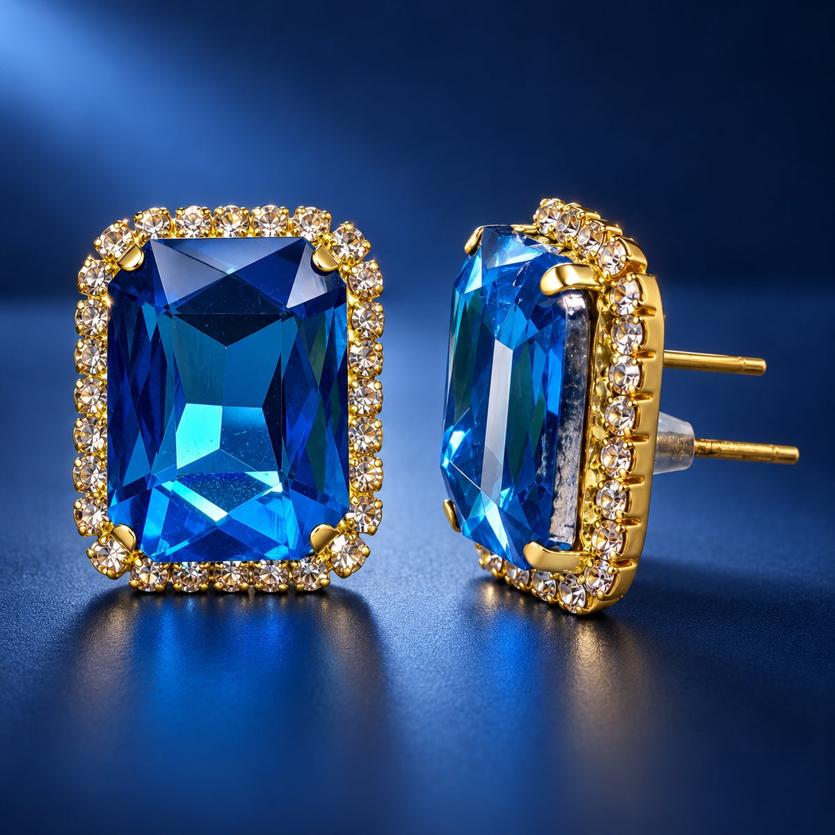 Regal Ocean Blue Halo Studs gold-tone halo stud earrings with ocean blue emerald-cut stone