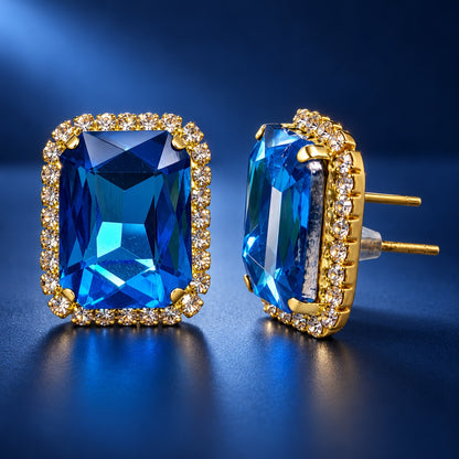 Regal Ocean Blue Halo Studs gold-tone halo stud earrings with ocean blue emerald-cut stone