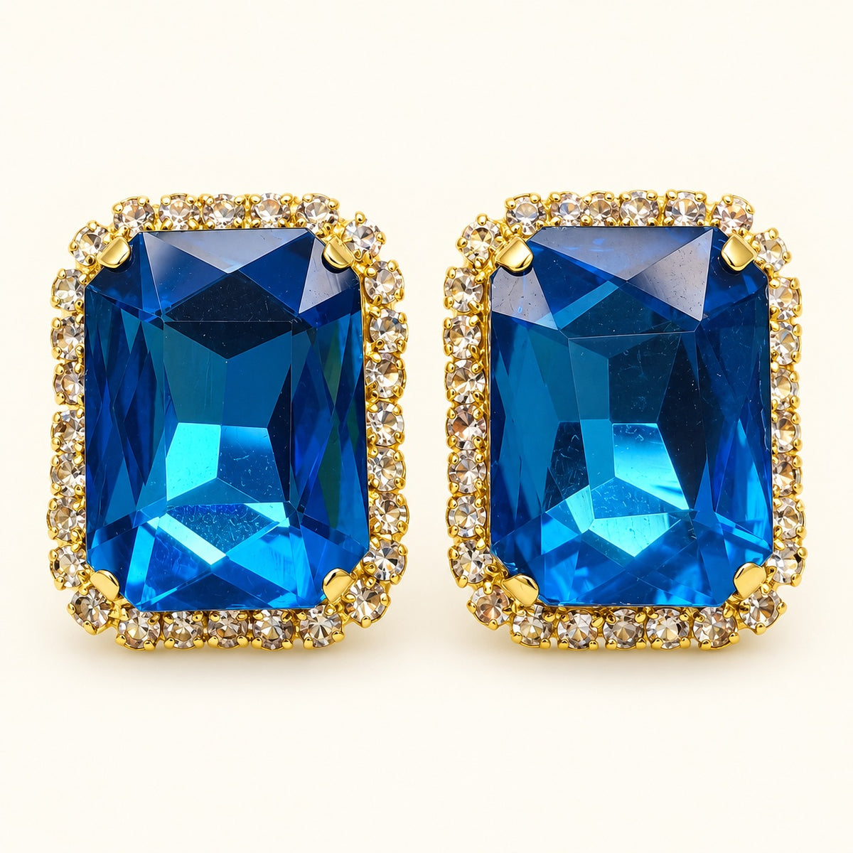 Front view of Regal Ocean Blue Halo Studs showing the crystal halo and ocean blue centre stone