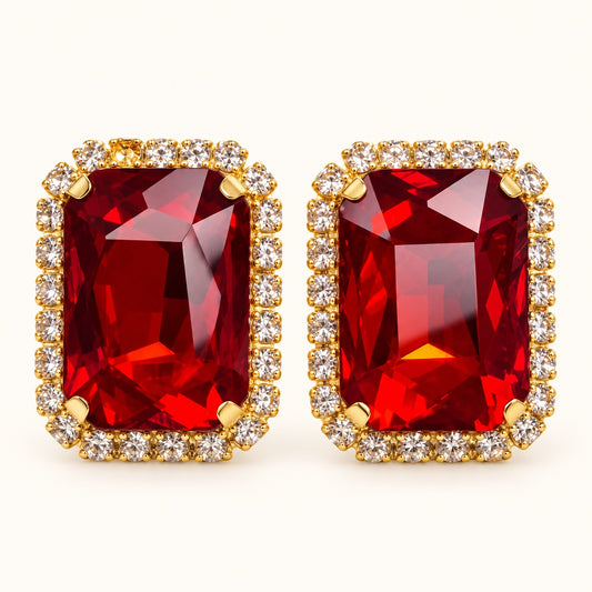 Front view of Regal Ruby Red Halo Studs with ruby red emerald-cut stone and cubic zirconia halo