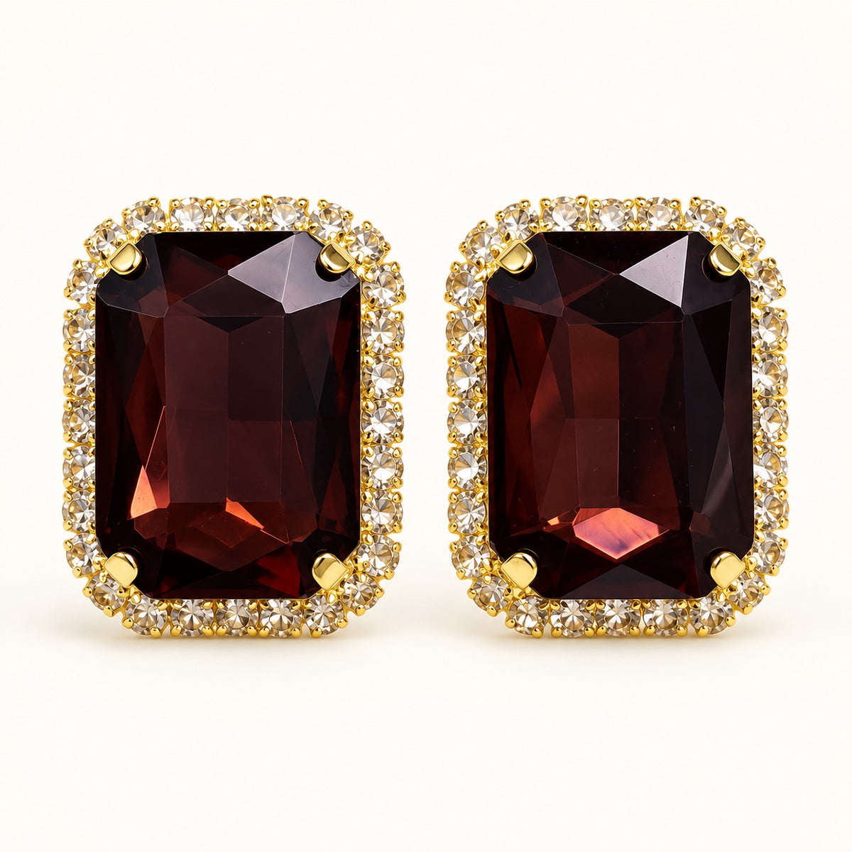 Front view of Regal Wine Halo Studs with deep wine emerald-cut stone and cubic zirconia halo