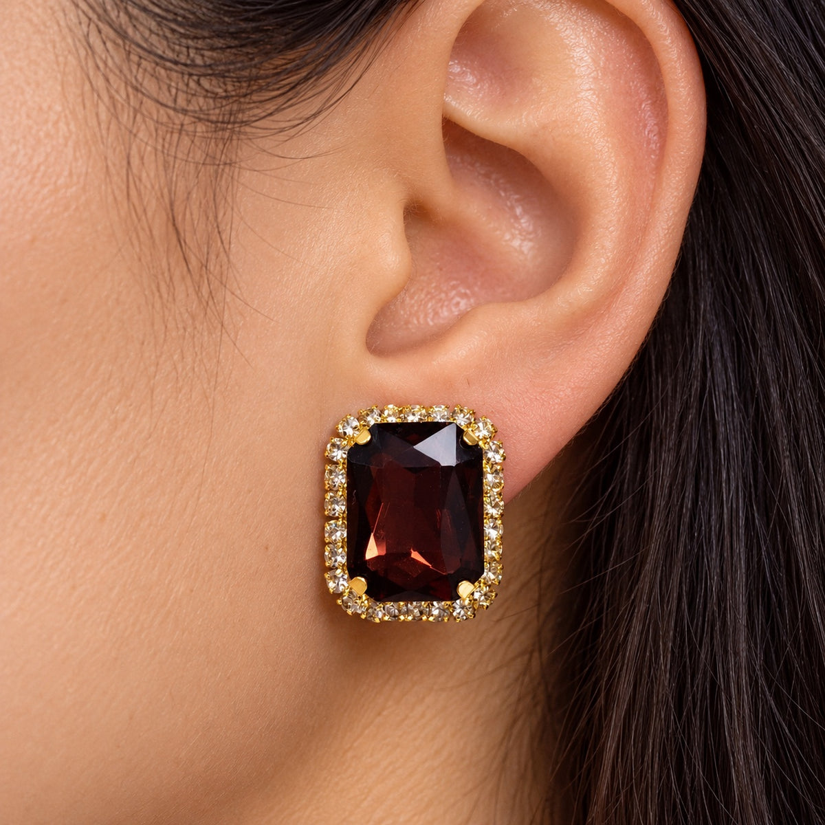 Model wearing Regal Wine Halo Studs gold-tone halo stud earrings