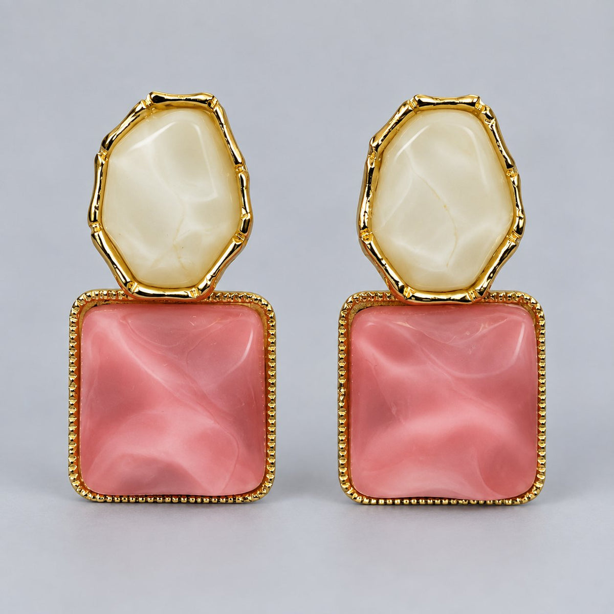 Front view of Rose Marble Square Drops with pink marbled squares and ivory stone tops