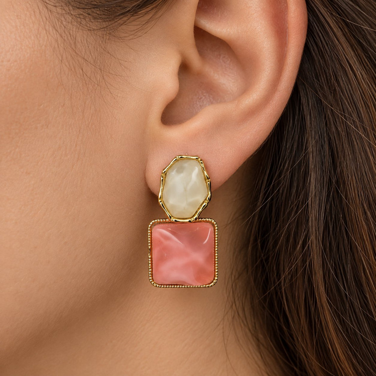 Model wearing Rose Marble Square Drops gold-tone earrings