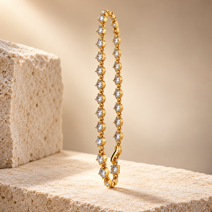 Sparkling CZ Link Bracelet gold-tone bracelet with round clear stones on a stone block