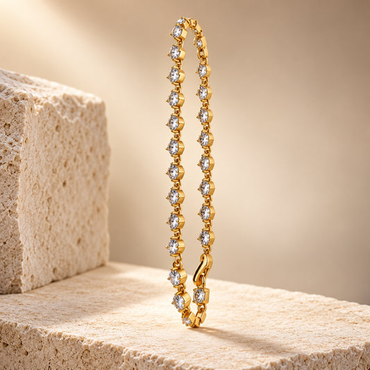 Sparkling CZ Link Bracelet gold-tone bracelet with round clear stones on a stone block