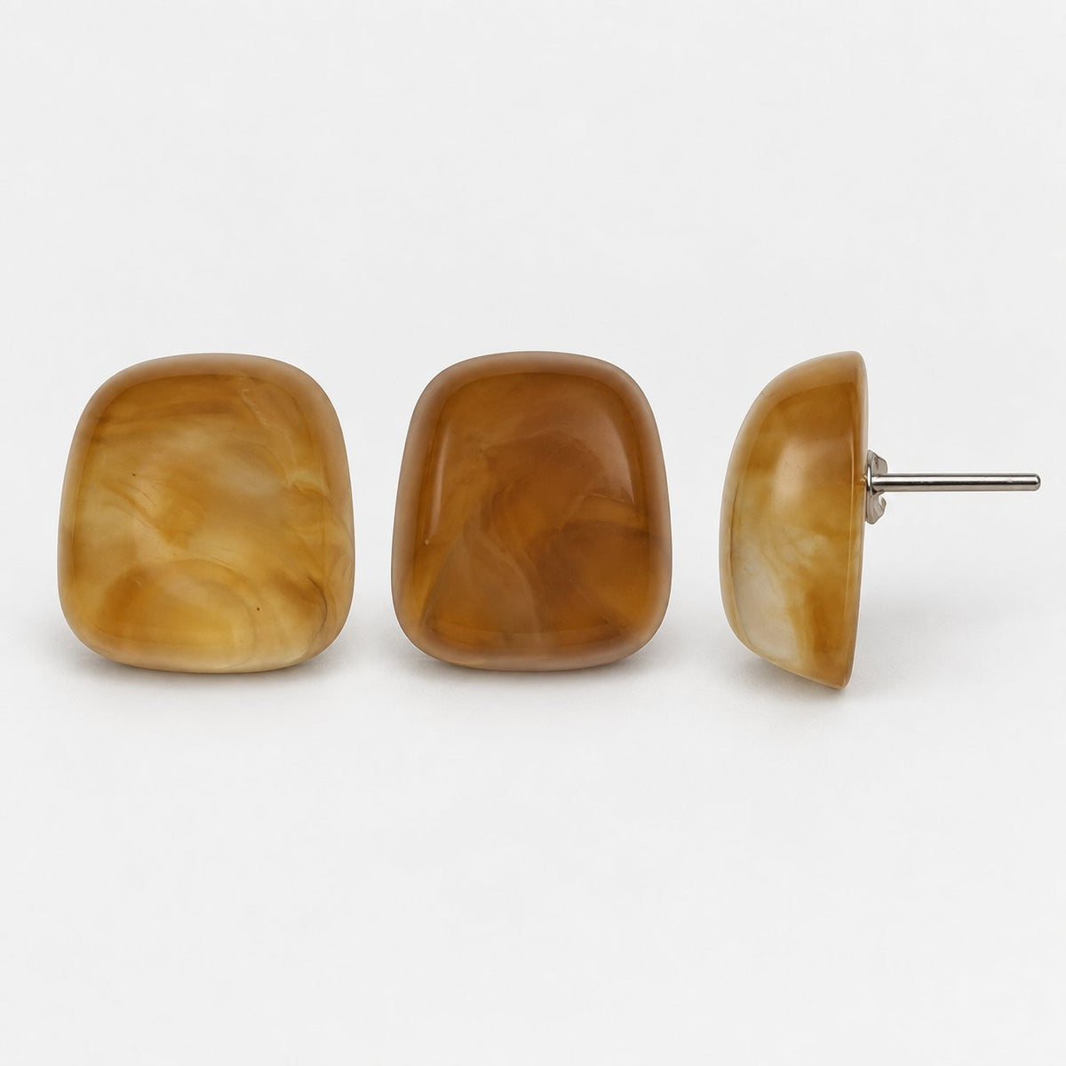 Side view of Sunlit Amber Cabochon Studs showing the domed profile and silver-tone post