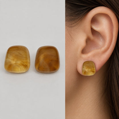 Model wearing Sunlit Amber Cabochon Studs sunlit amber stud earrings