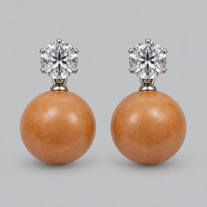 Front view of tangerine orb drop earrings with sparkling round top stones