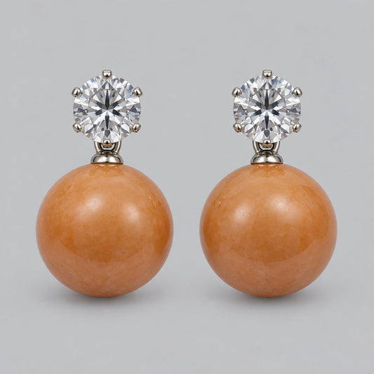 Front view of tangerine orb drop earrings with sparkling round top stones