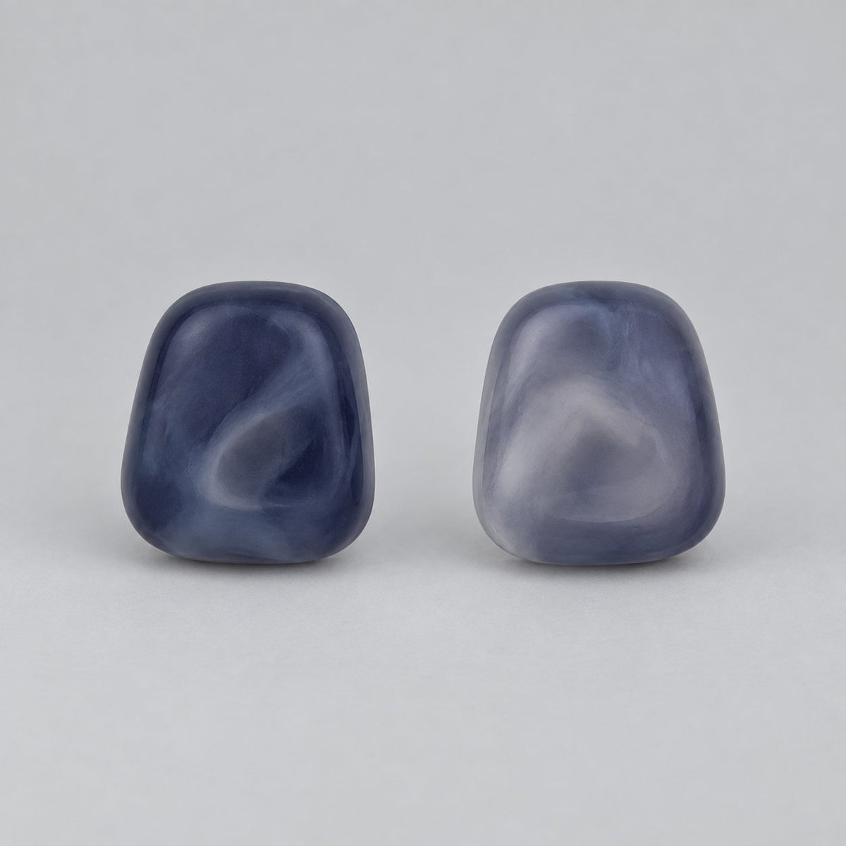 Front view of twilight blue cushion cabochon stud earrings