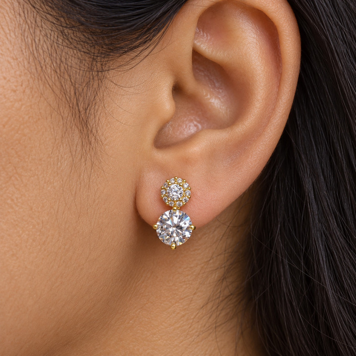 Model wearing Twin Solitaire CZ Studs gold-tone stud earrings