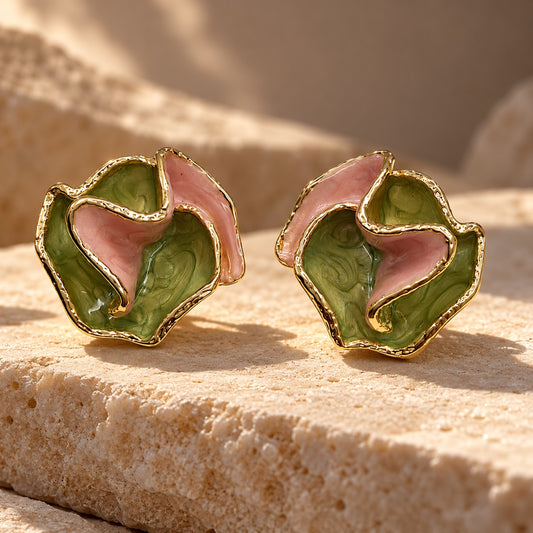 Verdant Rose Enamel Studs gold-tone earrings with ruffled green and pink enamel petals on a sandstone block
